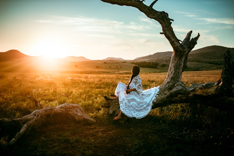 Oklahoma Family Photographer, woman sitting on fallen tree